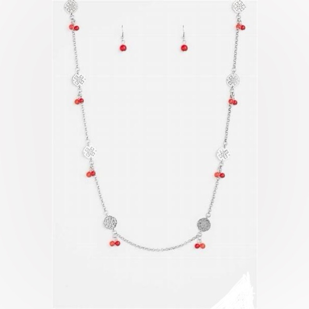*Long red beads and silver necklace.